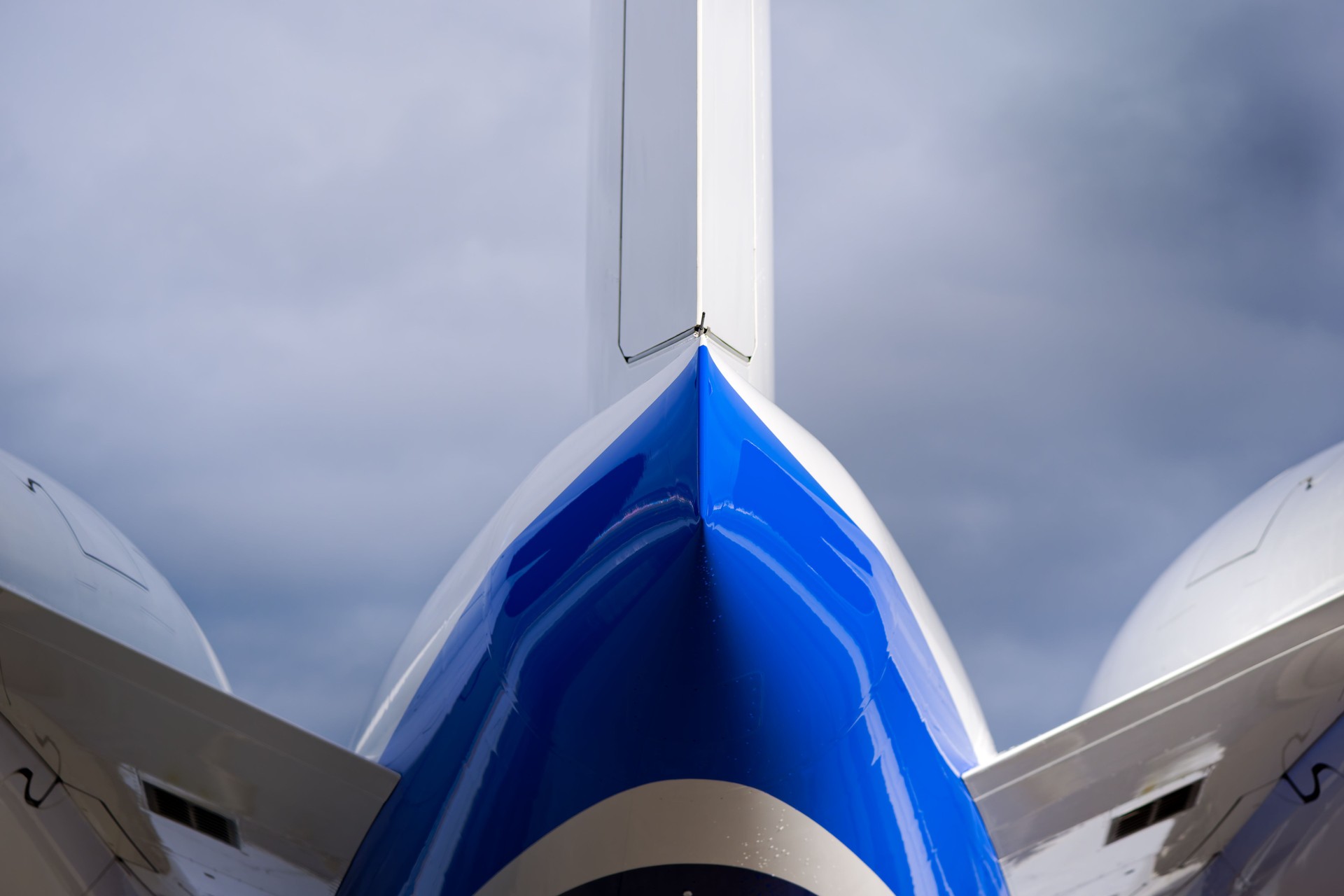 Close-up of tail of private jet at Swiss Airport Zürich Kloten on a winter day.